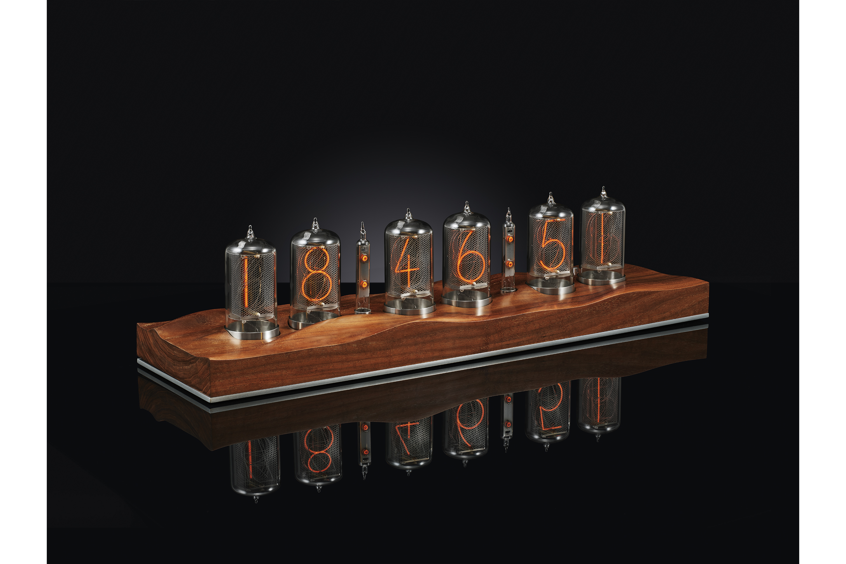 Nixie clock with class tubes sitting on a wooden based on a black back drop advertising image